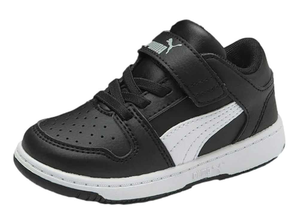 Tenis PUMA infantiles color negro con suela y franja lateral blanca, cierre de velcro.