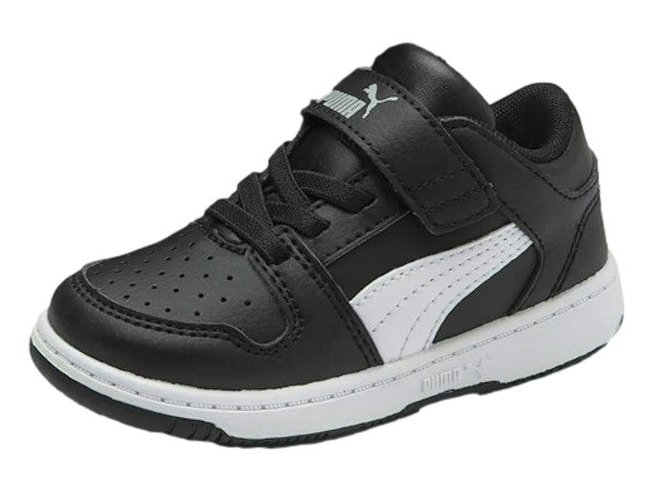 Tenis PUMA infantiles color negro con suela y franja lateral blanca, cierre de velcro.