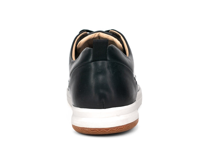 Tenis Dockers Malibu para hombre en color negro con suela blanca y marrón.