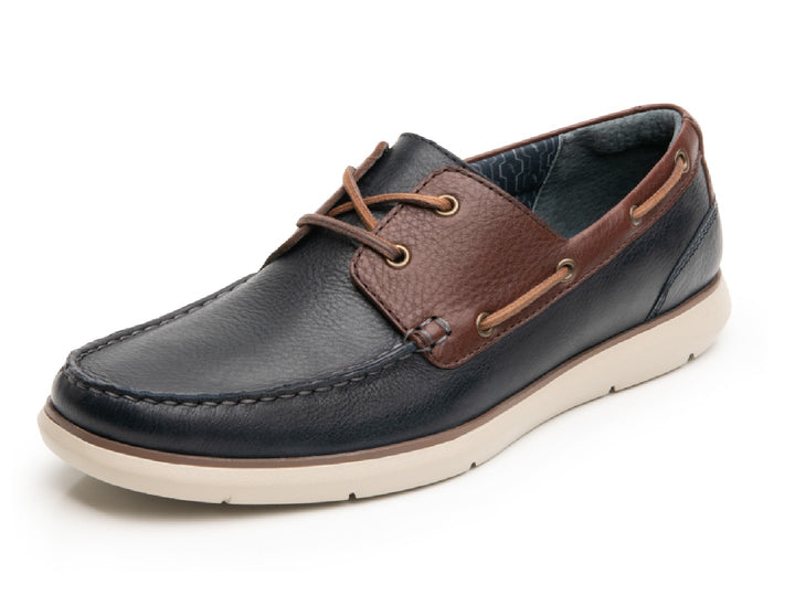 Zapato náutico Flexi para hombre en color azul marino y café con suela blanca.