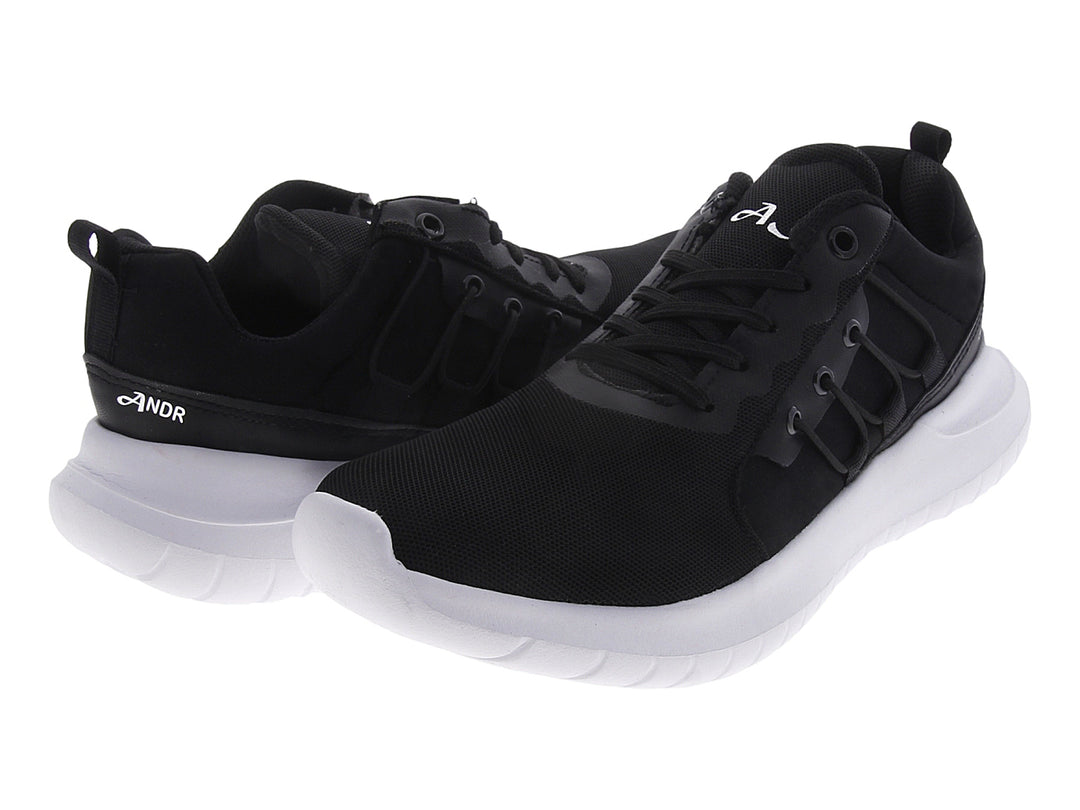 Tenis deportivos Andrax para mujer en color negro con suela blanca gruesa.