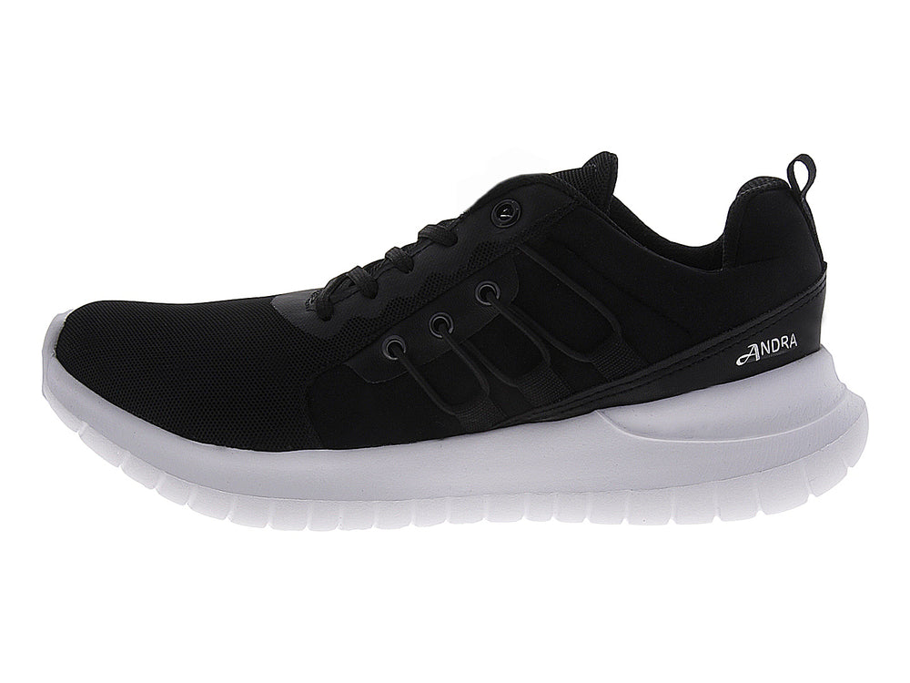Tenis deportivos Andrax para mujer en color negro con suela blanca gruesa.