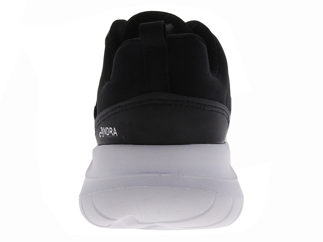 Tenis deportivos Andrax para mujer en color negro con suela blanca gruesa.