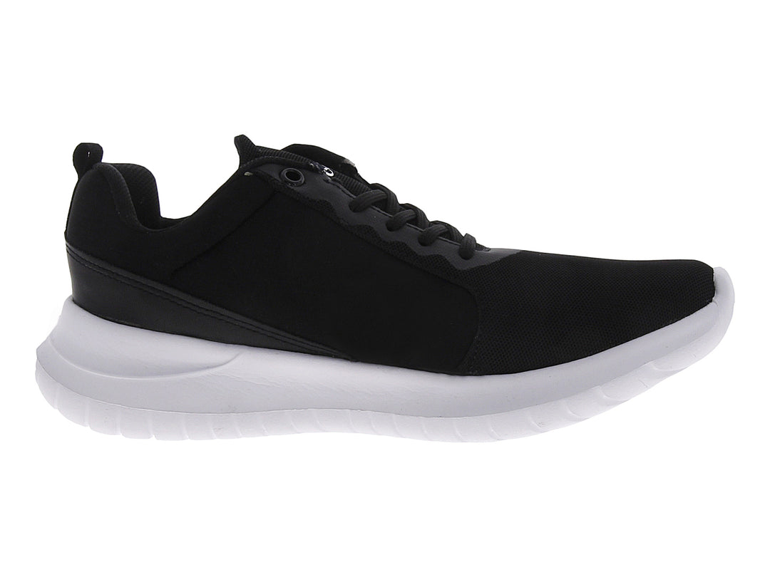 Tenis deportivos Andrax para mujer en color negro con suela blanca gruesa.