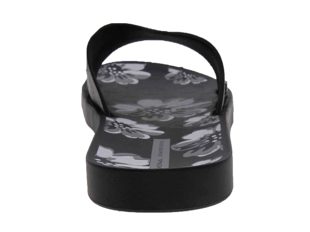 Sandalias Ipanema negras para mujer con diseño floral gris y correa brillante.