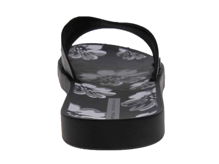 Sandalias Ipanema negras para mujer con diseño floral gris y correa brillante.