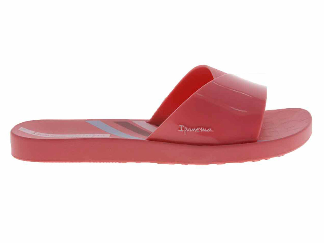 Sandalias slide de color rosa brillante con suela cómoda.