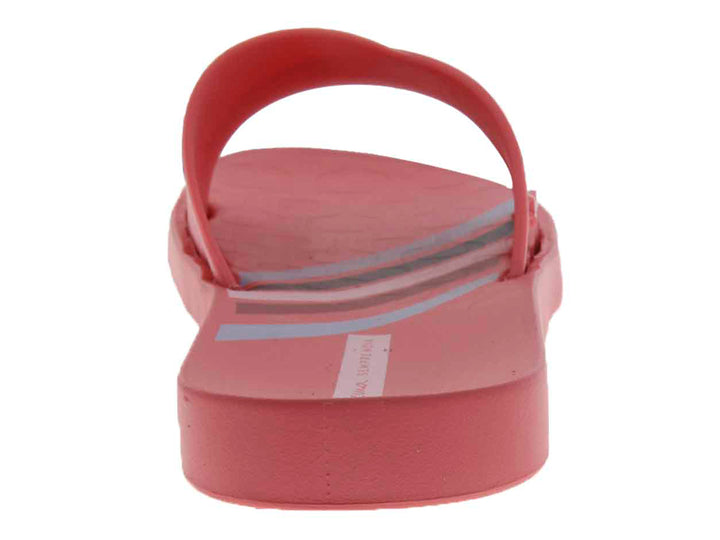 Sandalias slide de color rosa brillante con suela cómoda.