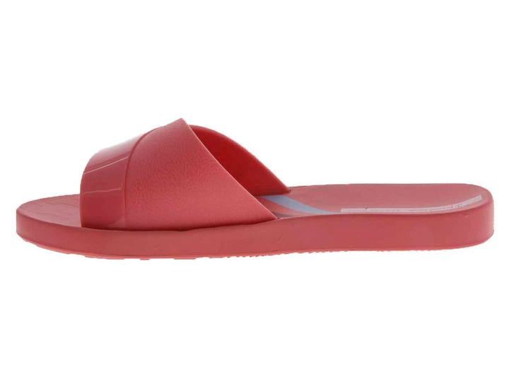 Sandalias slide de color rosa brillante con suela cómoda.
