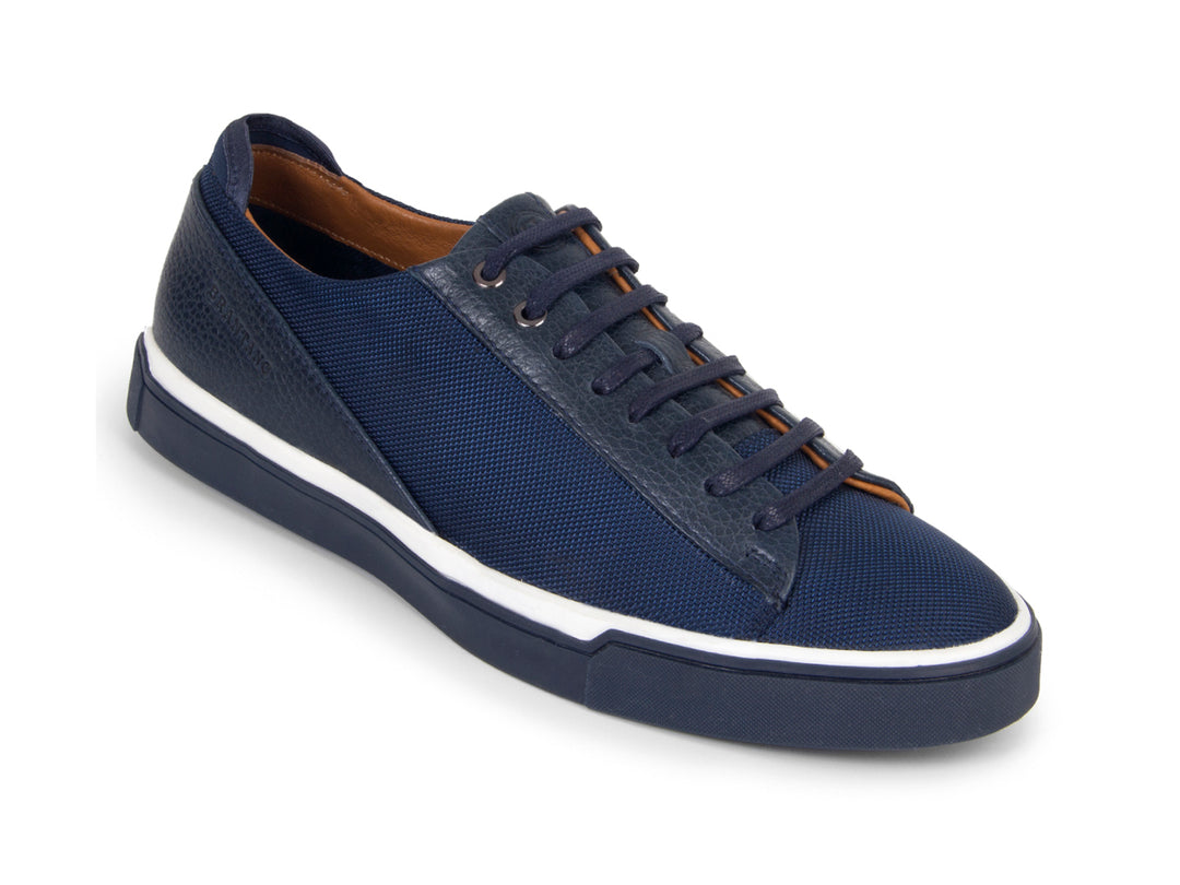 Tenis casuales color marino para hombre con suela blanca y detalles en tela y sintético.