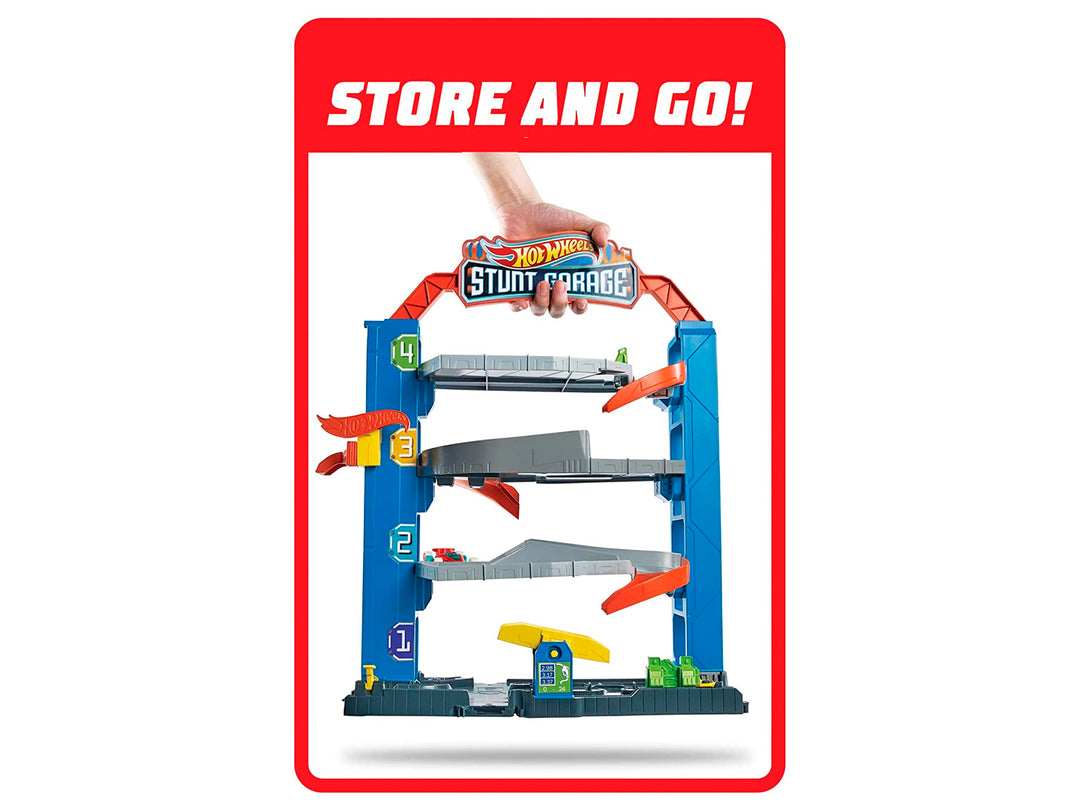 Set de juego Hot Wheels Stunt Garage con pista multinivel, rampas naranjas y un auto incluido en empaque original.