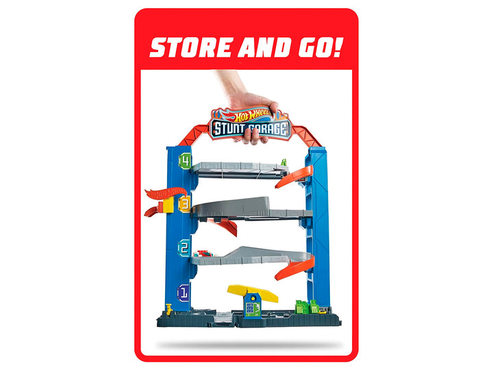 Set de juego Hot Wheels Stunt Garage con pista multinivel, rampas naranjas y un auto incluido en empaque original.