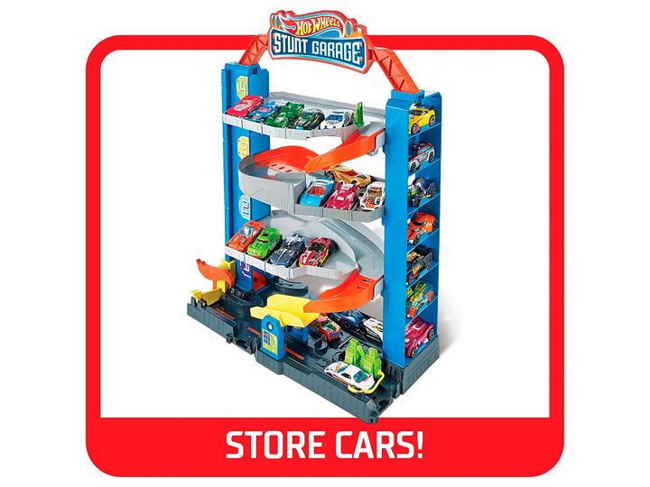 Set de juego Hot Wheels Stunt Garage con pista multinivel, rampas naranjas y un auto incluido en empaque original.