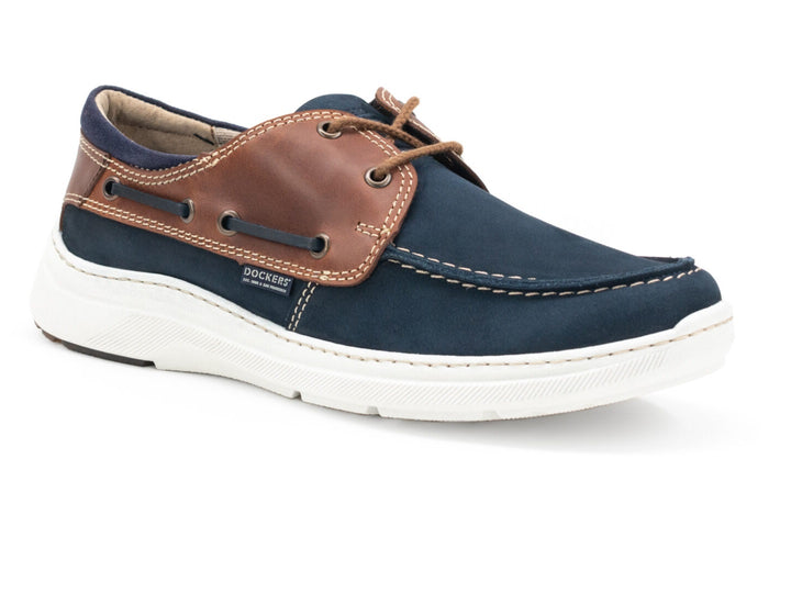 Zapato náutico Dockers Galia para hombre en color marino con detalles en cuero café y suela blanca.