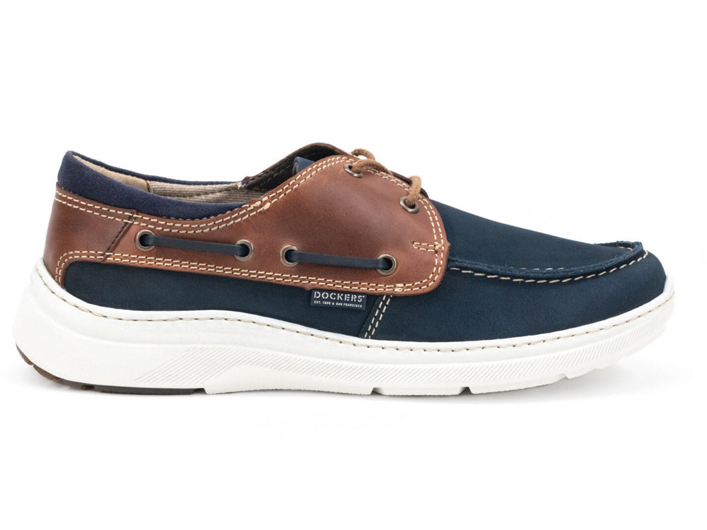 Zapato náutico Dockers Galia para hombre en color marino con detalles en cuero café y suela blanca.