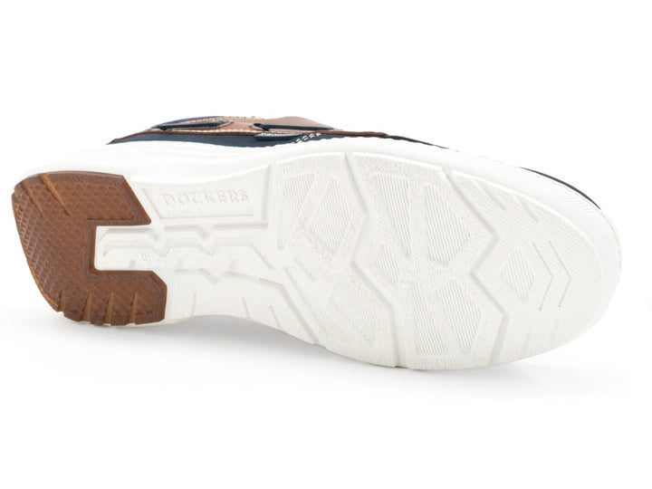 Zapato náutico Dockers Galia para hombre en color marino con detalles en cuero café y suela blanca.