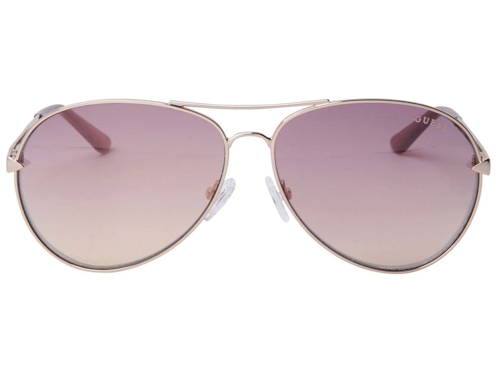 Lentes de sol Guess para mujer con montura metálica dorada y cristales degradados en tonos morados.
