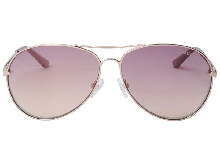 Lentes de sol Guess para mujer con montura metálica dorada y cristales degradados en tonos morados.