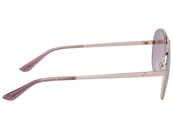 Lentes de sol Guess para mujer con montura metálica dorada y cristales degradados en tonos morados.