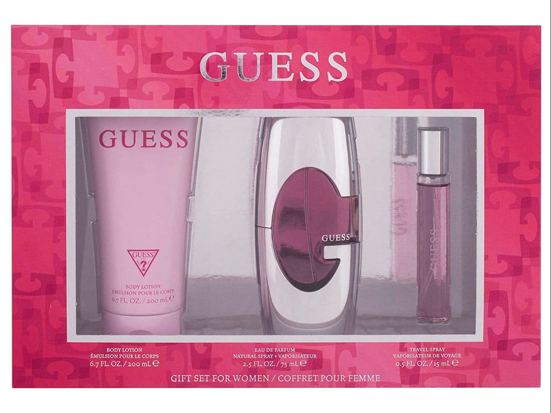 Set de fragancia GUESS para mujer con loción, perfume y spray de viaje en empaque rosa.