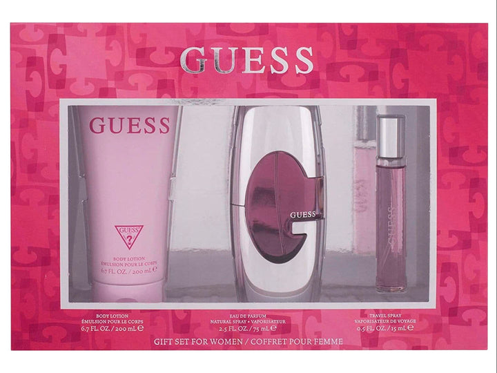 Set de fragancia GUESS para mujer con loción, perfume y spray de viaje en empaque rosa.