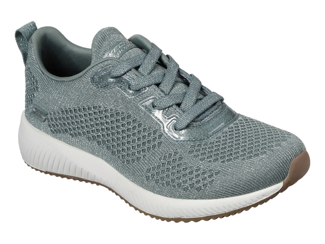 Tenis Skechers BOBS para mujer en color verde con suela blanca y base café.