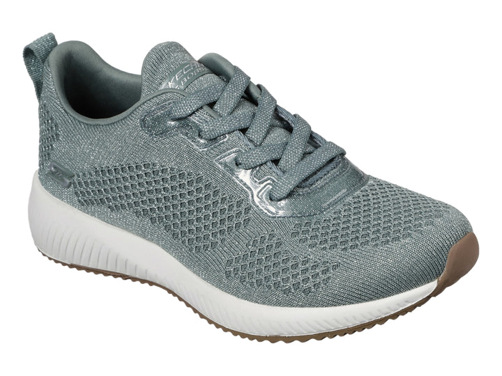 Tenis Skechers BOBS para mujer en color verde con suela blanca y base café.