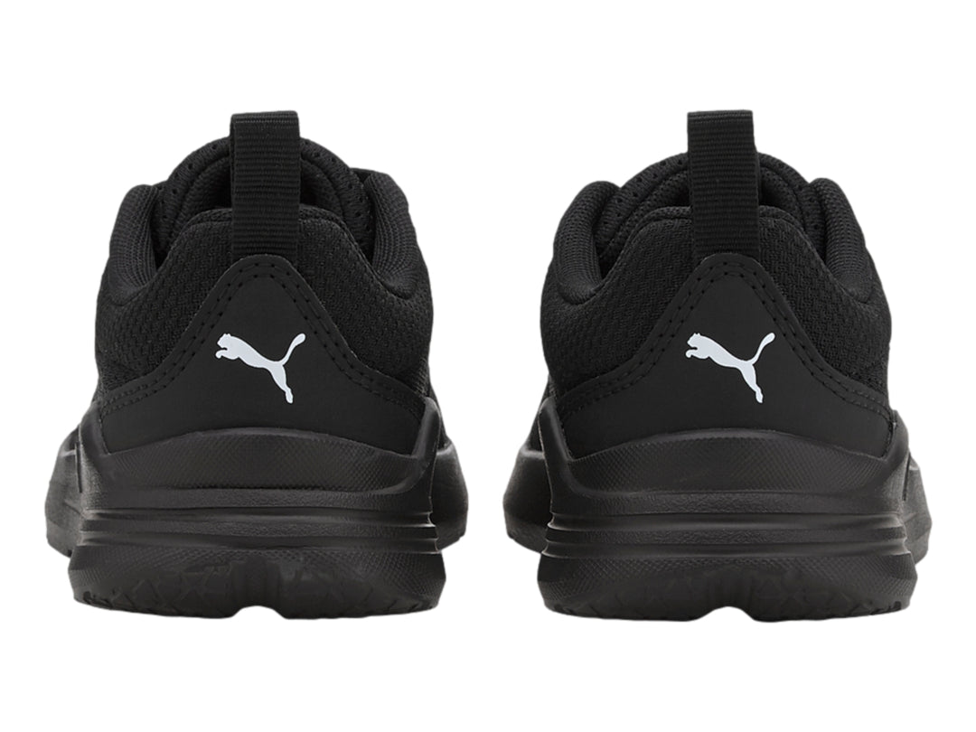 Tenis PUMA Wired Run JR color negro con malla transpirable y suela deportiva.