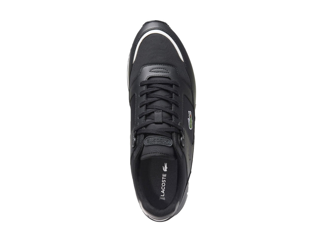 Tenis Lacoste Partner para hombre en color negro con suela blanca y gris.