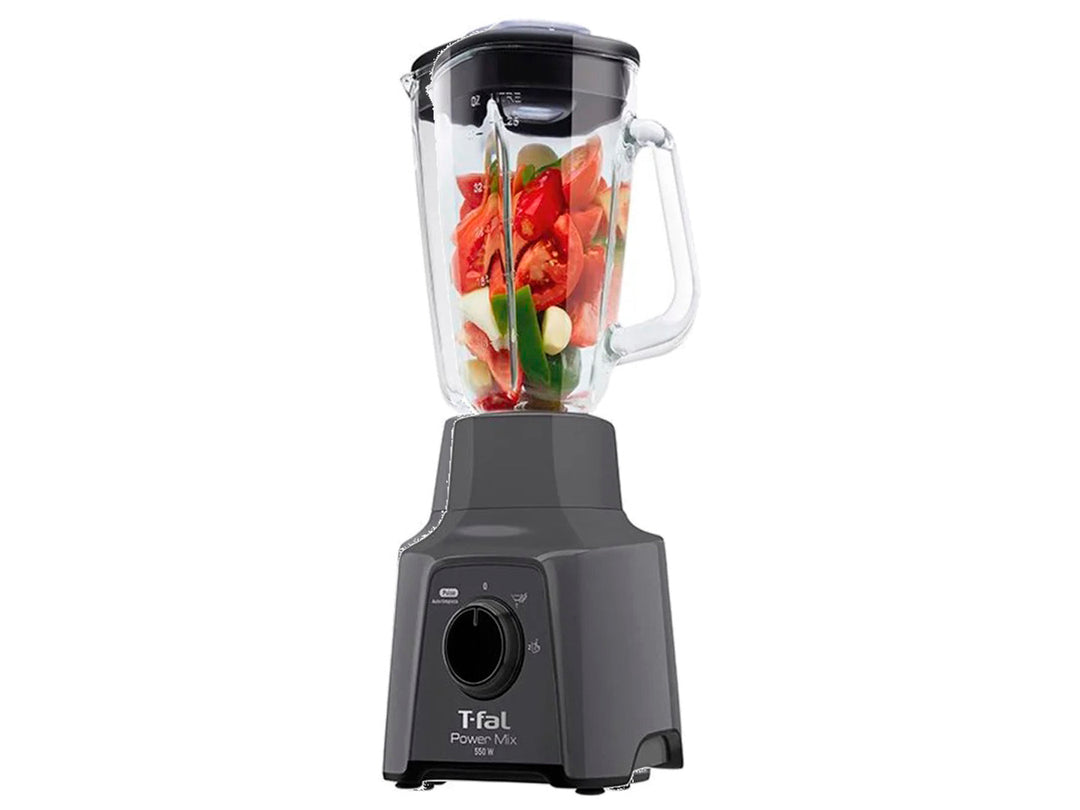 Licuadora T-fal con vaso de vidrio transparente, base negra y asa blanca.
