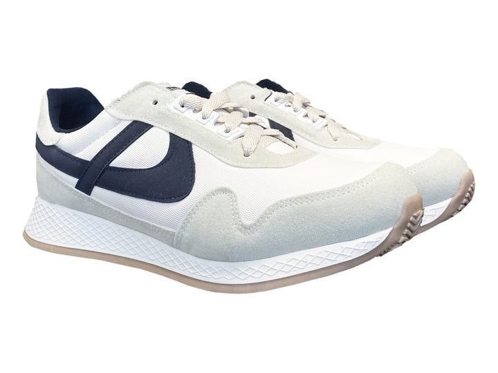 Tenis para niño PANAM color blanco y azul con detalles en gris y suela beige.