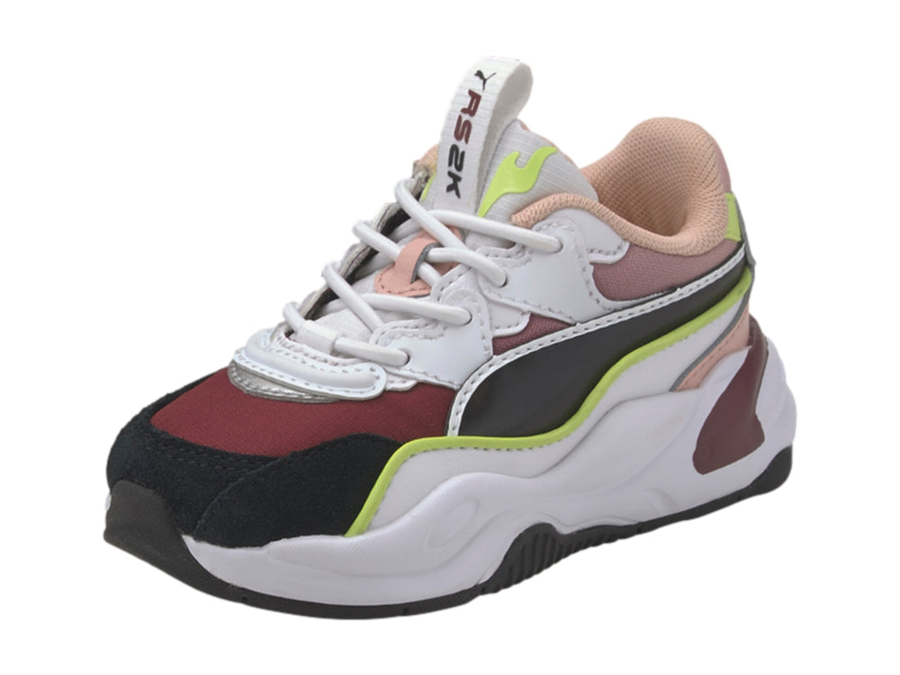 Tenis PUMA RS2K Space AC infantiles multicolor con suela blanca robusta y detalles en verde lima.