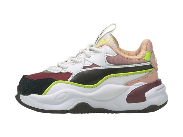 Tenis PUMA RS2K Space AC infantiles multicolor con suela blanca robusta y detalles en verde lima.