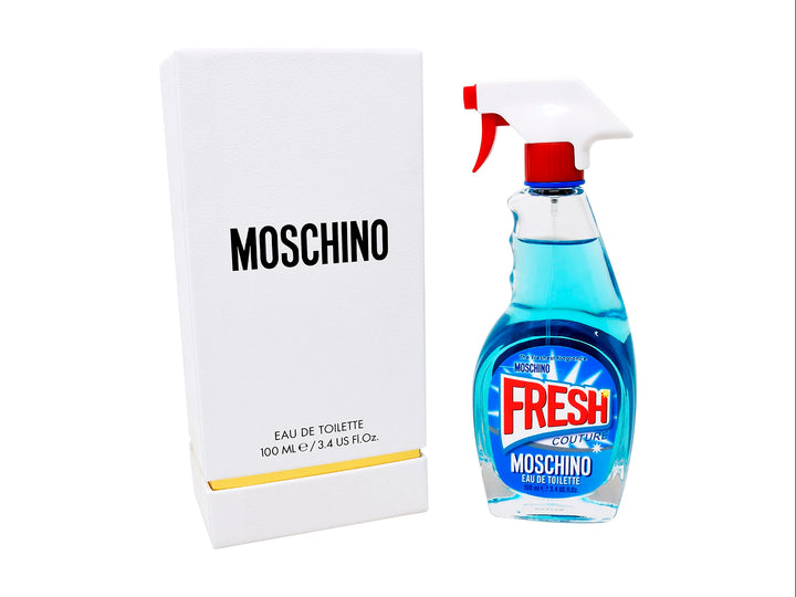 Perfume Moschino Fresh Couture en botella azul con forma de limpiador doméstico y su caja blanca.
