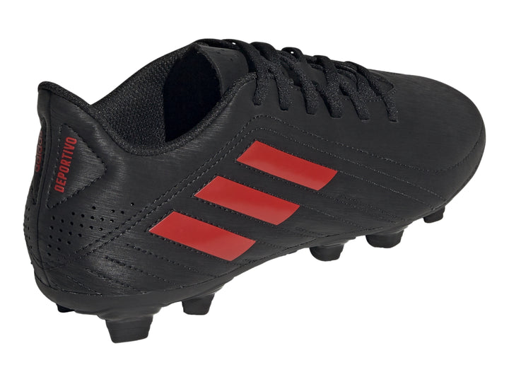 Zapato de fútbol Adidas color negro con tres franjas rojas y suela de tacos.