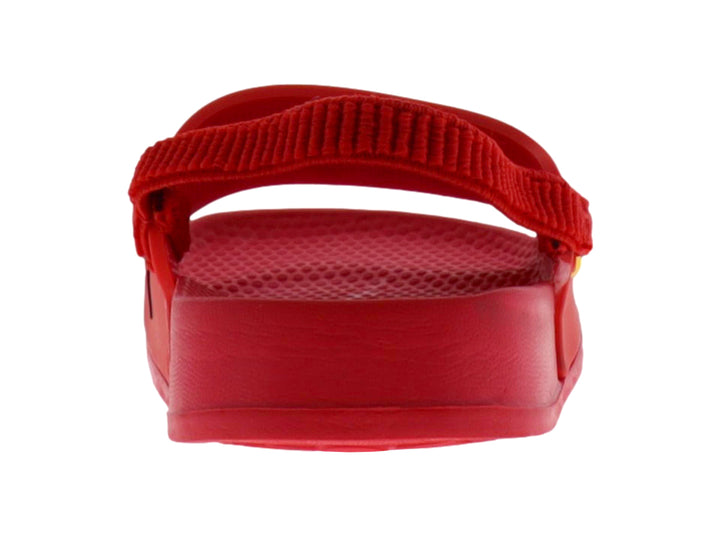 Sandalia roja infantil con diseño de cara de monstruo y dientes amarillos.
