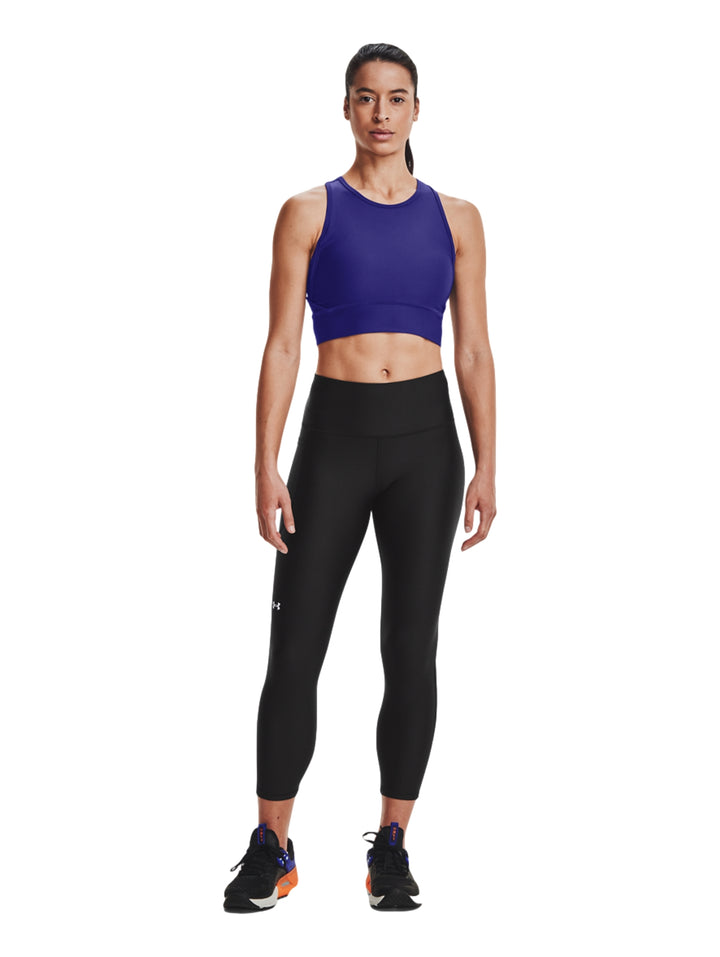Mallas deportivas negras Under Armour para mujer con corte al tobillo.