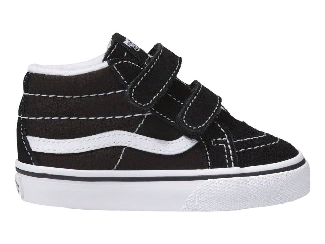 Tenis Vans Sk8 Mid Reissue color negro con suela blanca y cierres de velcro.