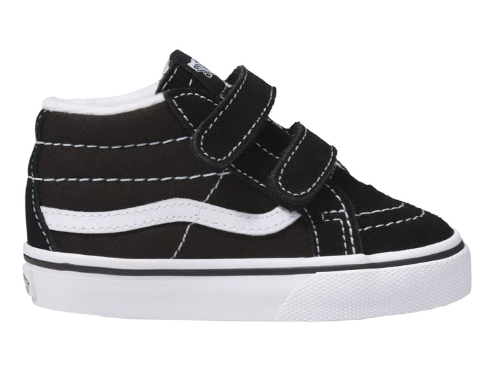 Tenis Vans Sk8 Mid Reissue color negro con suela blanca y cierres de velcro.
