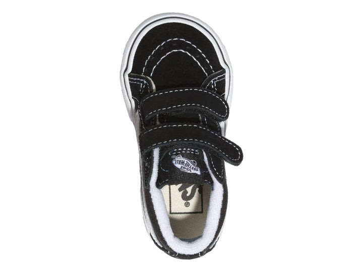 Tenis Vans Sk8 Mid Reissue color negro con suela blanca y cierres de velcro.