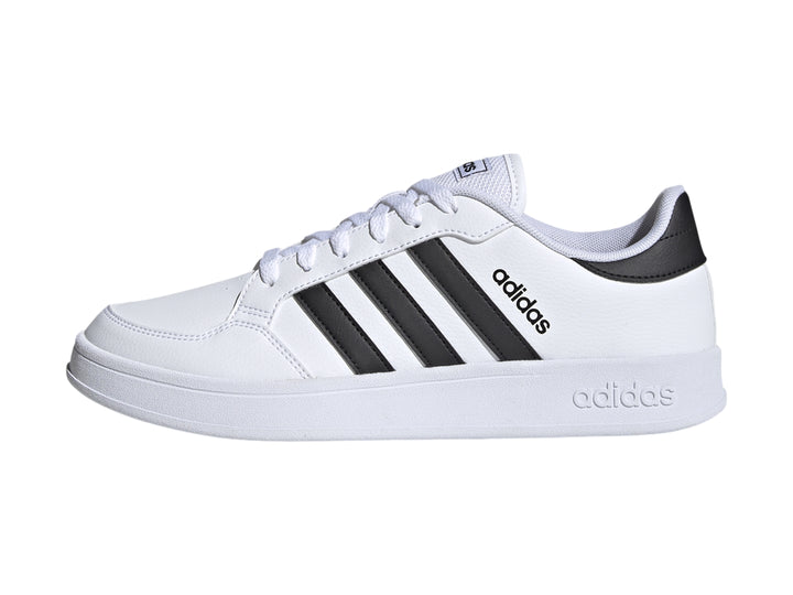 Tenis Adidas Breaknet en color blanco con las tres franjas laterales en negro y suela blanca.