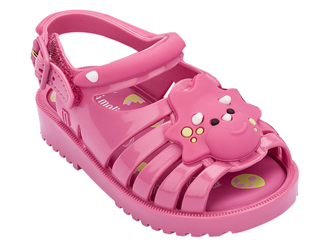 Sandalia infantil de plástico color rosa con detalle decorativo frontal y correas ajustables.