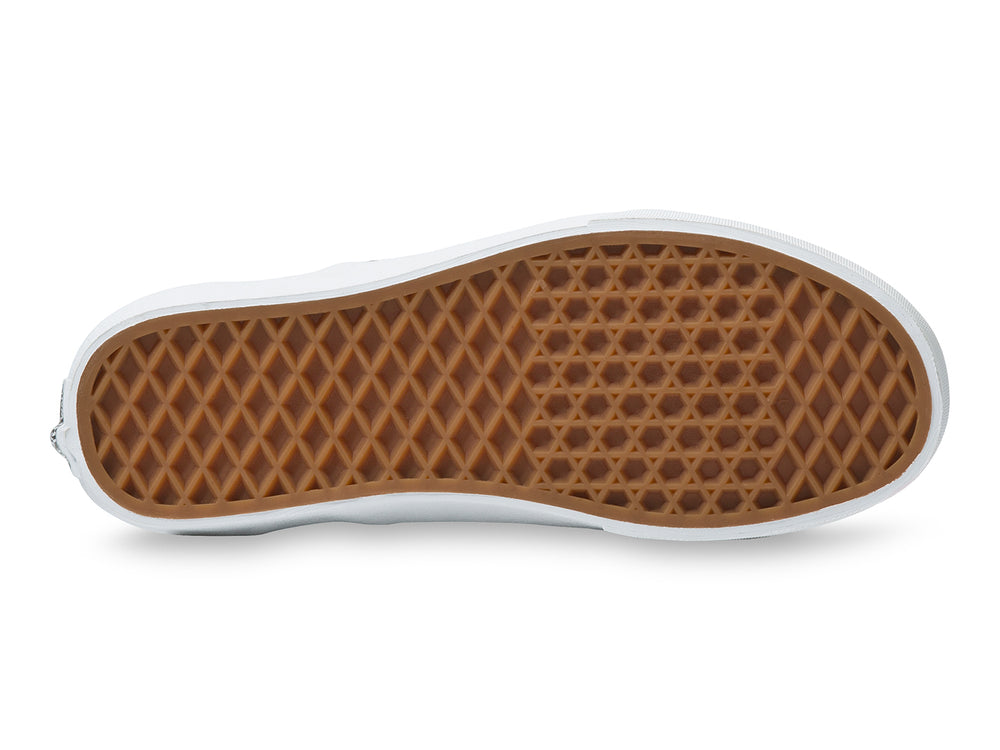 Tenis Vans Classic Slip On con estampado de galaxia en tonos azul y púrpura y suela blanca.