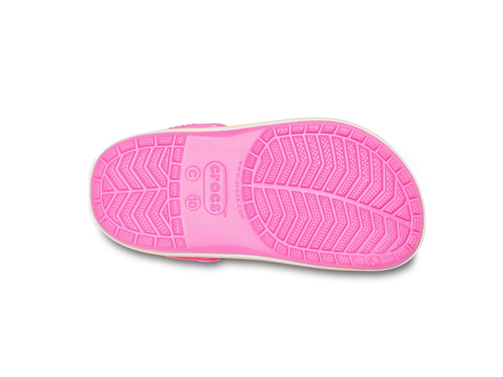 Zuecos Crocs Crocband para niño o niña en color rosa eléctrico con franja naranja en la suela.