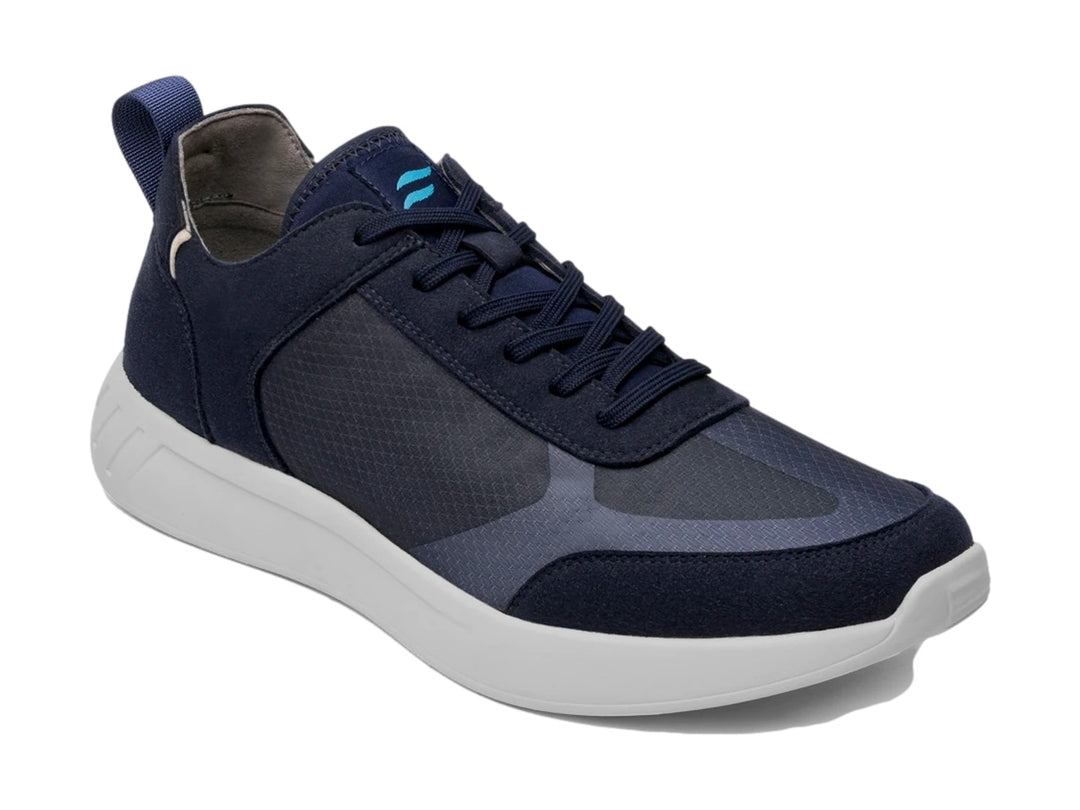 Tenis Flexi Forseti para hombre en color azul con suela blanca y detalles en gamuza.