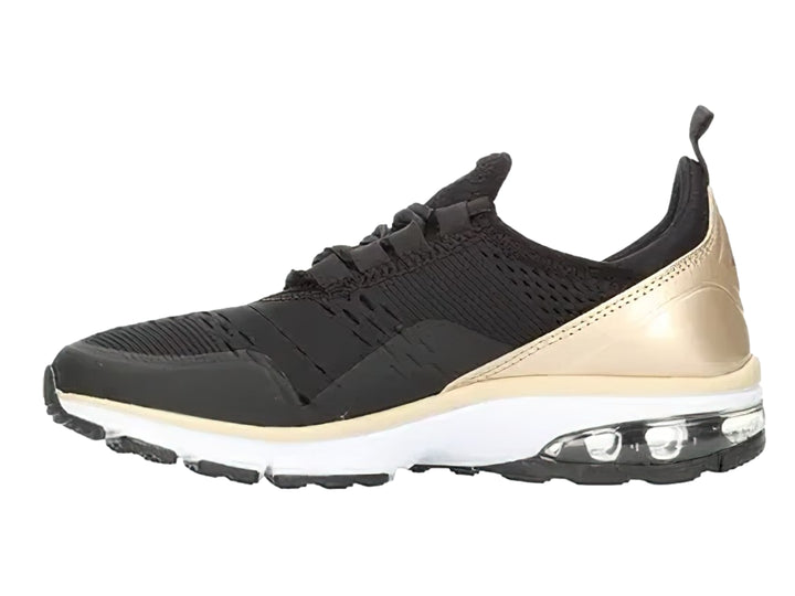 Tenis deportivos color negro con detalles en oro y suela blanca con amortiguación de aire.