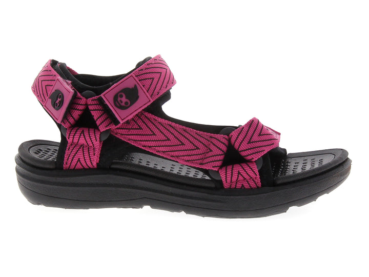 Sandalia para niña color rosa fucsia con suela negra y diseño tipo gladiador.