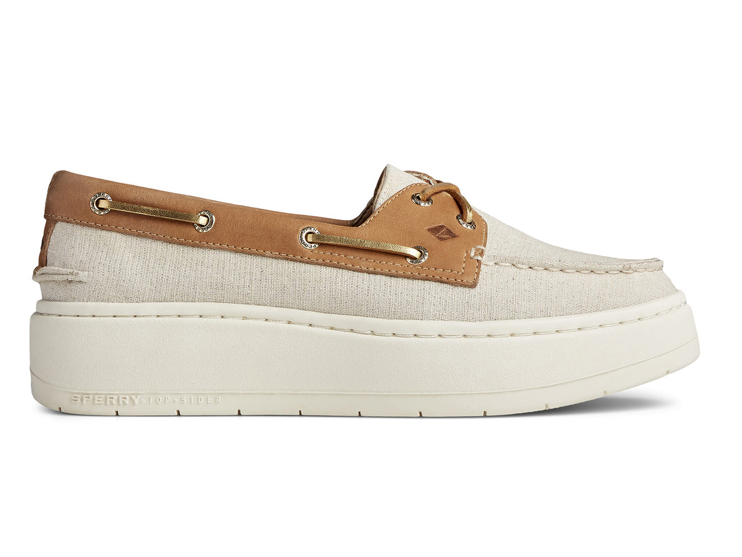 Zapato náutico Sperry de plataforma en color blanco con detalles en cuero café y suela blanca gruesa.