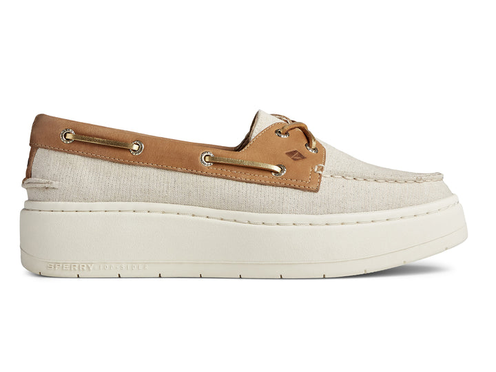 Zapato náutico Sperry de plataforma en color blanco con detalles en cuero café y suela blanca gruesa.