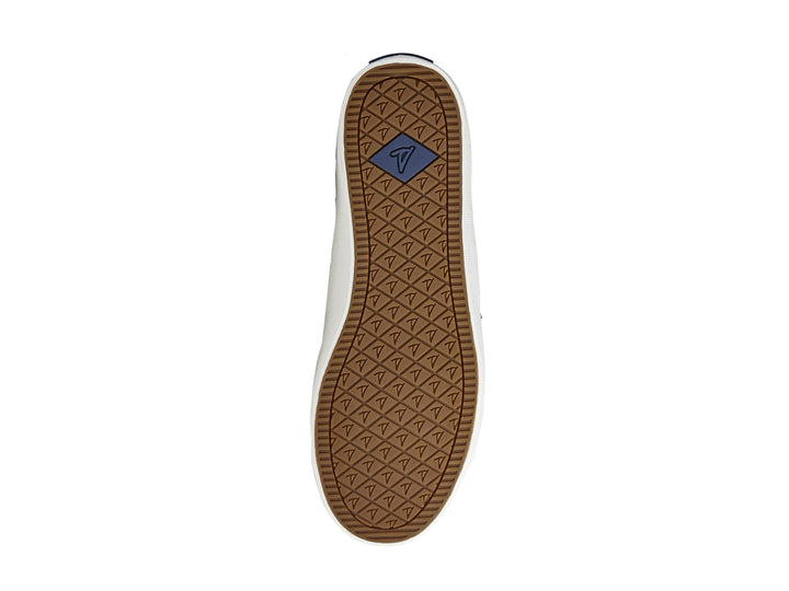 Zapato Sperry negro con franja plateada y suela blanca para mujer.